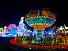 wahana komidi putar dengan lampu warna-warni di milenial glow garden kota batu