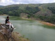 Menikmati Danau Tao dari ketinggian area perbukitan